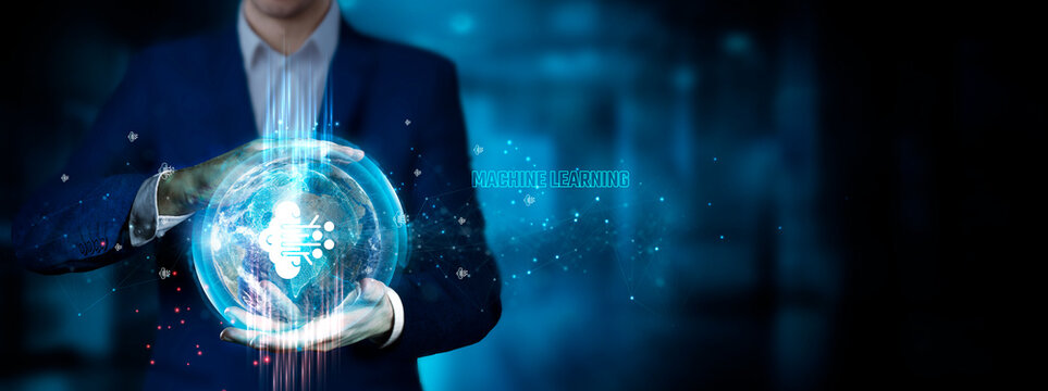 Machine Learning: Businessman holding innovation technology to develop smart solutions from digital interfaces. Data-driven insights, pattern recognition.