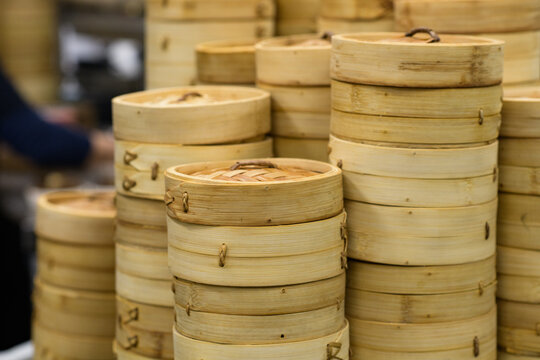 Stacks of bamboo steamers in a Chinese restaurant kitchen