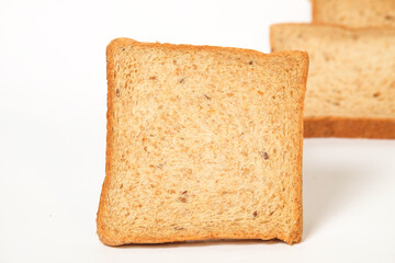 Close up white bread isolated on white background.White bread is brown.Copy space for graphic design or banner background.Bread for breakfast.Food product concept