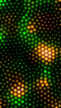 Looped animation of green to yellow dots on black background