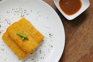 Crispy Fried Pastel Served with Sambal on Elegant White Plate Indonesian Snack Asian Food
