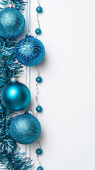 Elegant Christmas Decorations, Glittering Blue Baubles and Tinsel on White Vertical Background