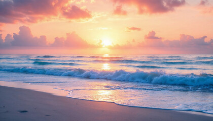 A peaceful sunset over the ocean, with waves gently lapping at the sandy beach.

