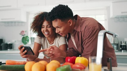 Couple, happy and phone in kitchen for recipe, video tutorial and viral cooking fail on social media. Man, woman or mobile at vegetables for diet planning, streaming platform or laugh at meme in home