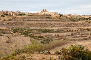 Gozo (Għawdex) Island landscape around the village of Għarb and Basilica and Collegiate Parish...
