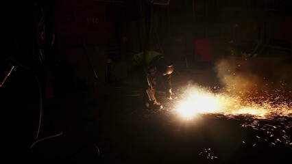 Experience the stunning nighttime sparks from a welding operation in an industrial site. Stock Clip