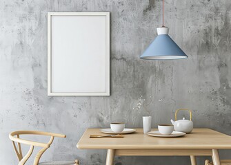 A white framed poster hangs on a gray concrete wall above a wooden table set with dishes and a teapot A blue pendant light hangs above the table