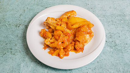 Roasted potatoes and chicken on plate
