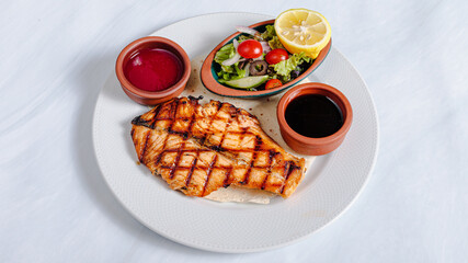 Fish steak, vegetables and sauce