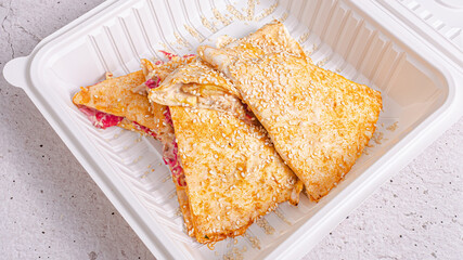 Sandwich in plastic plate isolated
