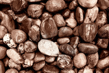 Close-Up View of Smooth River Stones. Demonstrating color of 2025 year.