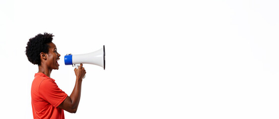 Fototapeta premium African American woman is speaking into a bullhorn, speaking loudly on a white background, banner