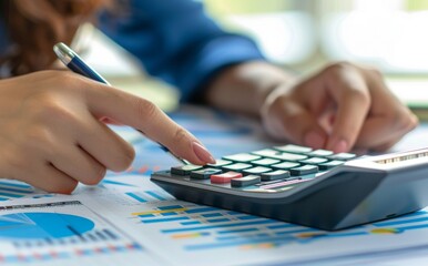 woman accountant doing finance and calculate on a desk about cost at the home office. finance accounting concept