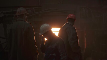 The dedicated workers at the Industrial Furnace play a crucial role in steel manufacturing. Stock...