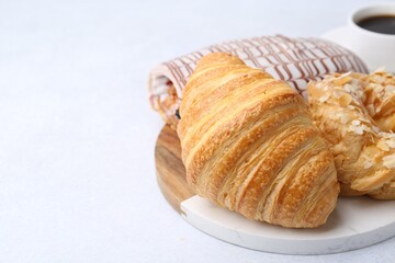 Different sweet pastries on light table, closeup. Space for text