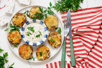 Baked mushrooms stuffed with cheese with sauce.selective focus