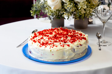 Traditional and delicious red velvet cake isolated on blue plate