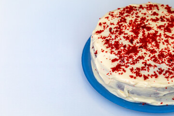 Traditional and delicious red velvet cake isolated on blue plate