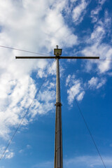 Metal Christian cross near the village of Krum, Municipality of Dimitrovgrad, Haskovo Province, southern Bulgaria, low-angle partial view on a cloudy background 