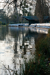 Reflective waters and serene pathways in Bois de Vincennes during a quiet afternoon in Paris