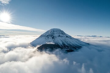 A mountain covered in clouds is seen from above
