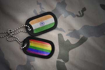 army blank, dog tag with rainbow gay pride flag and india on the khaki texture background. military...