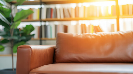 A warm, stylish living room featuring a plush brown couch and charming bookshelves, perfect for relaxation and reading.