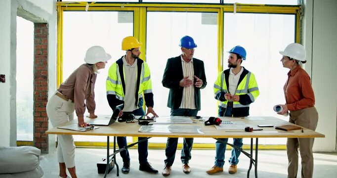 Blueprint, collaboration and planning with construction worker team in office for discussion. Architecture, building and floor plan with engineering group on site for property development strategy
