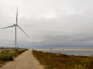 Sandy road and a wind turbine, near Hirsthals beach