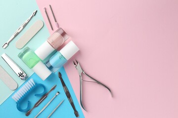 Set of pedicure tools on color background, flat lay. Space for text