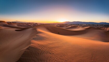 The fading sun casts a warm glow over the sands.  