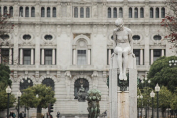 Fototapeta premium Statue on Avenue of Aliados in the city of Porto, Portugal. Beautiful avenue in the city centre, looking towards the city hall...