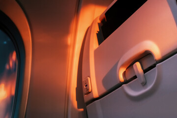 Close-up of the interior of the seat during sunset, air travel, seat details, relaxing on board