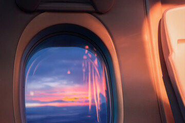 Naklejka premium Close-up of the interior of the window during sunset, air travel, seat details, relaxing on board