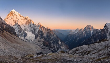 Fototapeta premium The first light of dawn breaks over the peaks. 