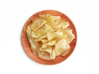 Keripik singkong or cassava chips on plate isolated on white background 