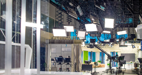 abstract background with interior of TV studio with filming and lighting equipment for banner background