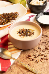 leek onion soup with chicken on a rustic table