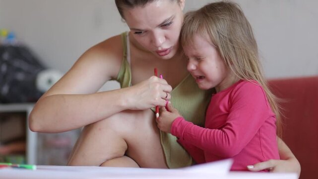 daughter cries at home sitting with mom
