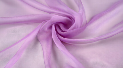 Obraz premium Soft lilac chiffon fabric gracefully draped, showcasing its delicate texture and translucent quality. Perfect for fashion, apparel, and design projects.