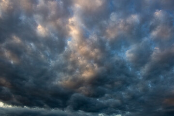 Obraz premium Dramatic sky with stormy clouds at sunset. Nature background