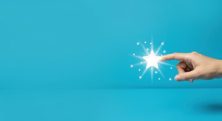 Fototapeta premium Hand of light-skinned female touching glowing star on blue background