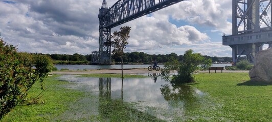 Water on the grass by Sagamore bridge crossing