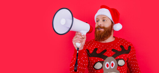 merry christmas. positive man announcing in loudspeaker about christmas sales. man at christmas