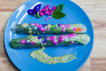 Fresh, colorful salad with vibrant vegetables on a white plate