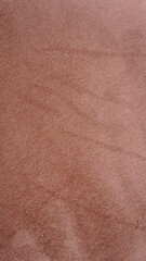 Close-Up Texture of Dusty Rose Suede Fabric