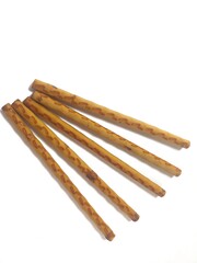 biscuit sticks with sweet chocolate filling on white background