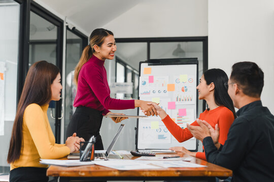 Business team shaking hands during successful meeting - Powered by Adobe