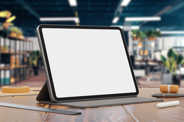 Modern workspace with tablet on desk in a bright office environment showcasing minimalist design and productivity tools