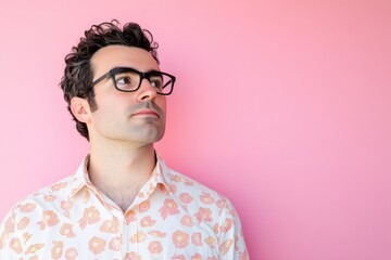 Obraz premium Stylish Young Man in Floral Shirt Against Pink Background